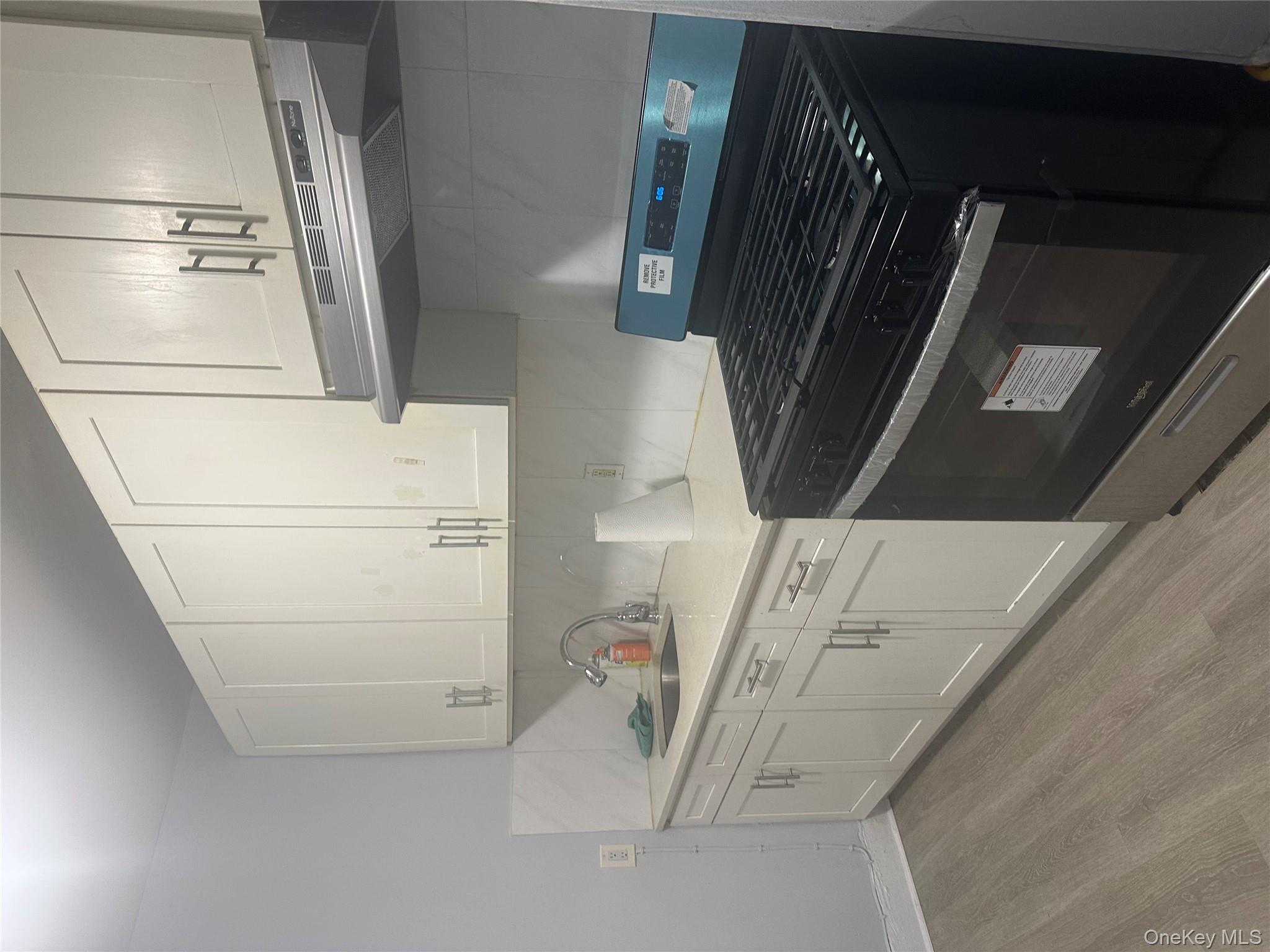 4 Ritters Lane Yonkers, NY 10703 - Photo 16 of 41 a stove top oven sitting inside of a kitchen