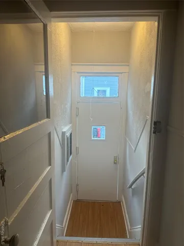 a view of entryway with wooden floor