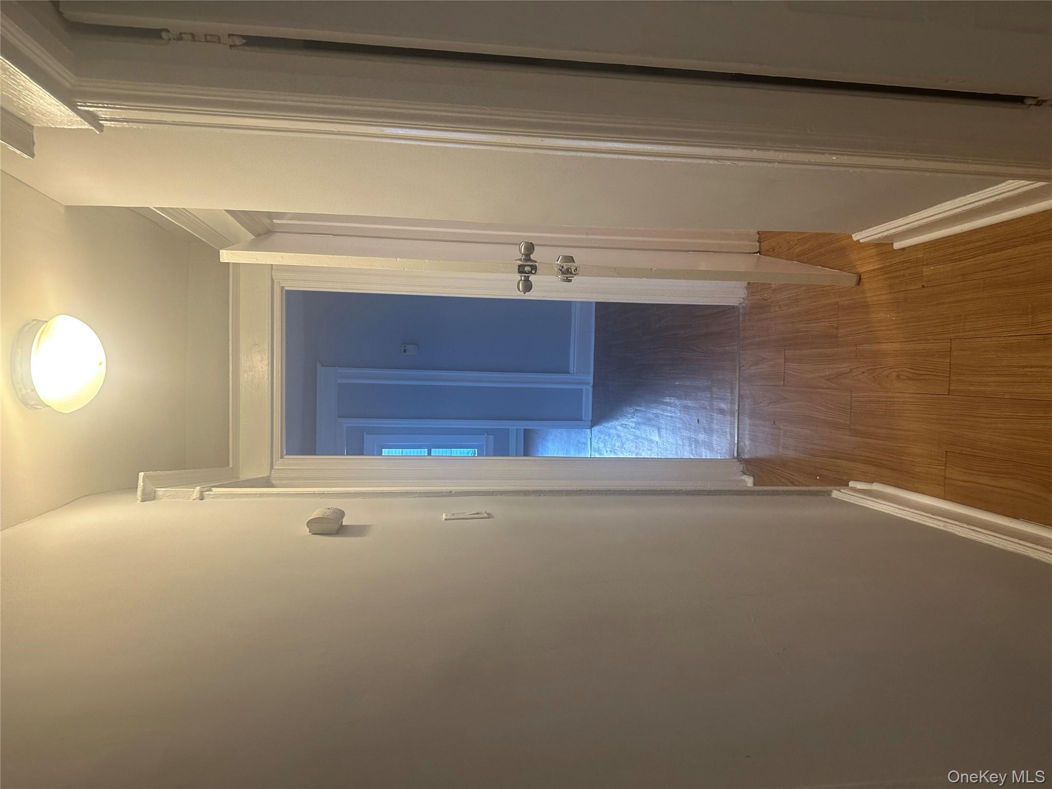 4 Ritters Lane Yonkers, NY 10703 - Photo 31 of 41 a view of a hallway with wooden floor