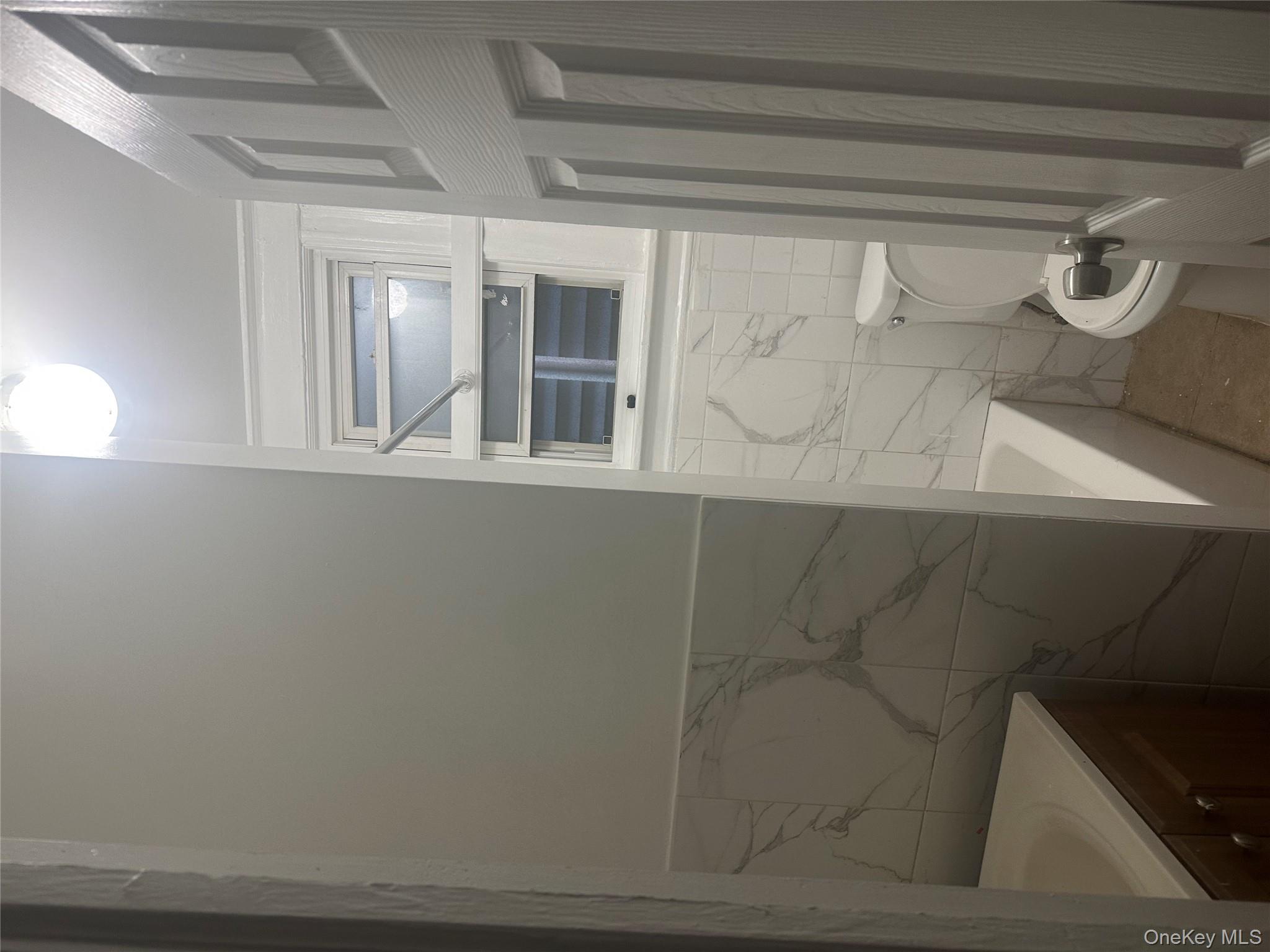 4 Ritters Lane Yonkers, NY 10703 - Photo 7 of 41 a bathroom with a toilet and a shower