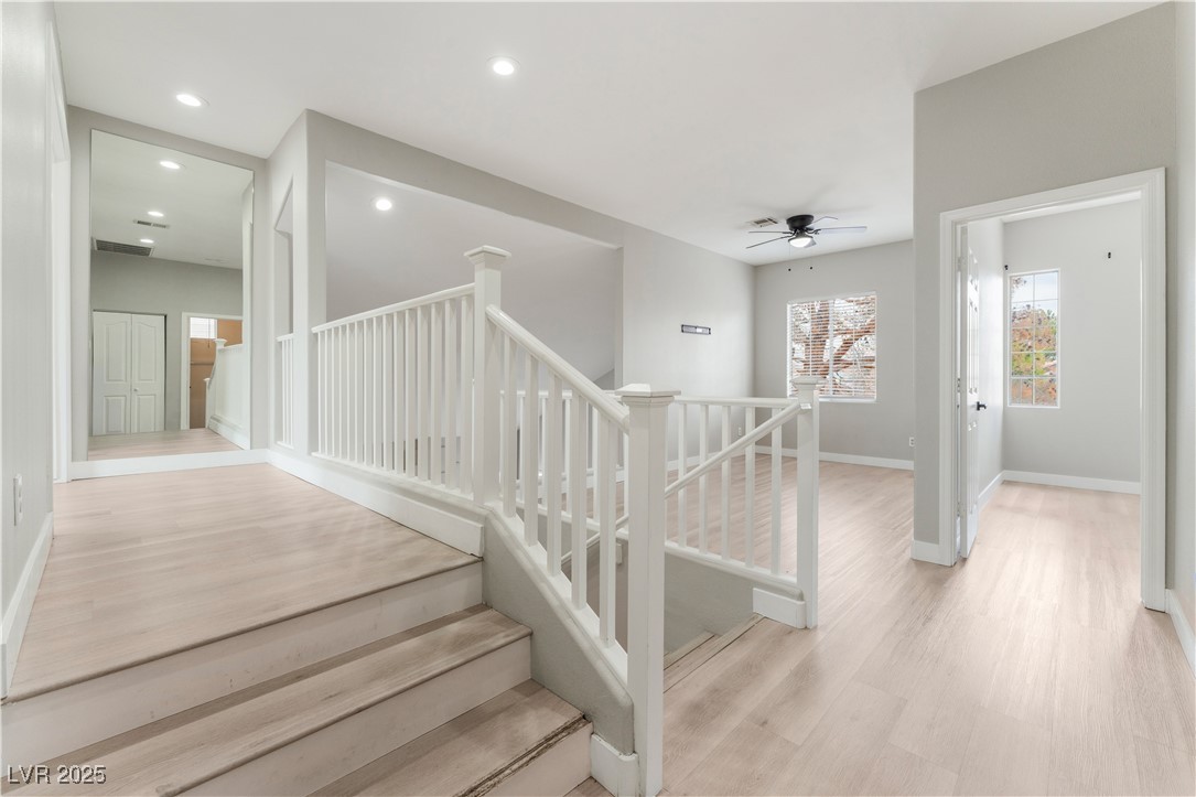 3695 Funston Way Las Vegas, NV 89129 - Photo 25 of 43 Stairway with wood finished floors, recessed lighting, and ceiling fan