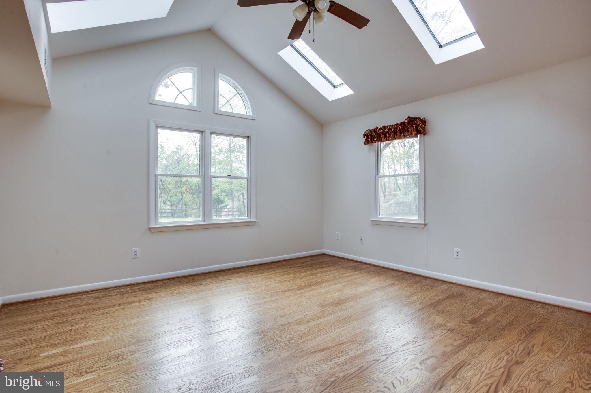 9713 Clarks Crossing Road Vienna, VA 22182 - Photo 13 of 36 Bright Family Room w/ Vaulted Ceiling & Skylights