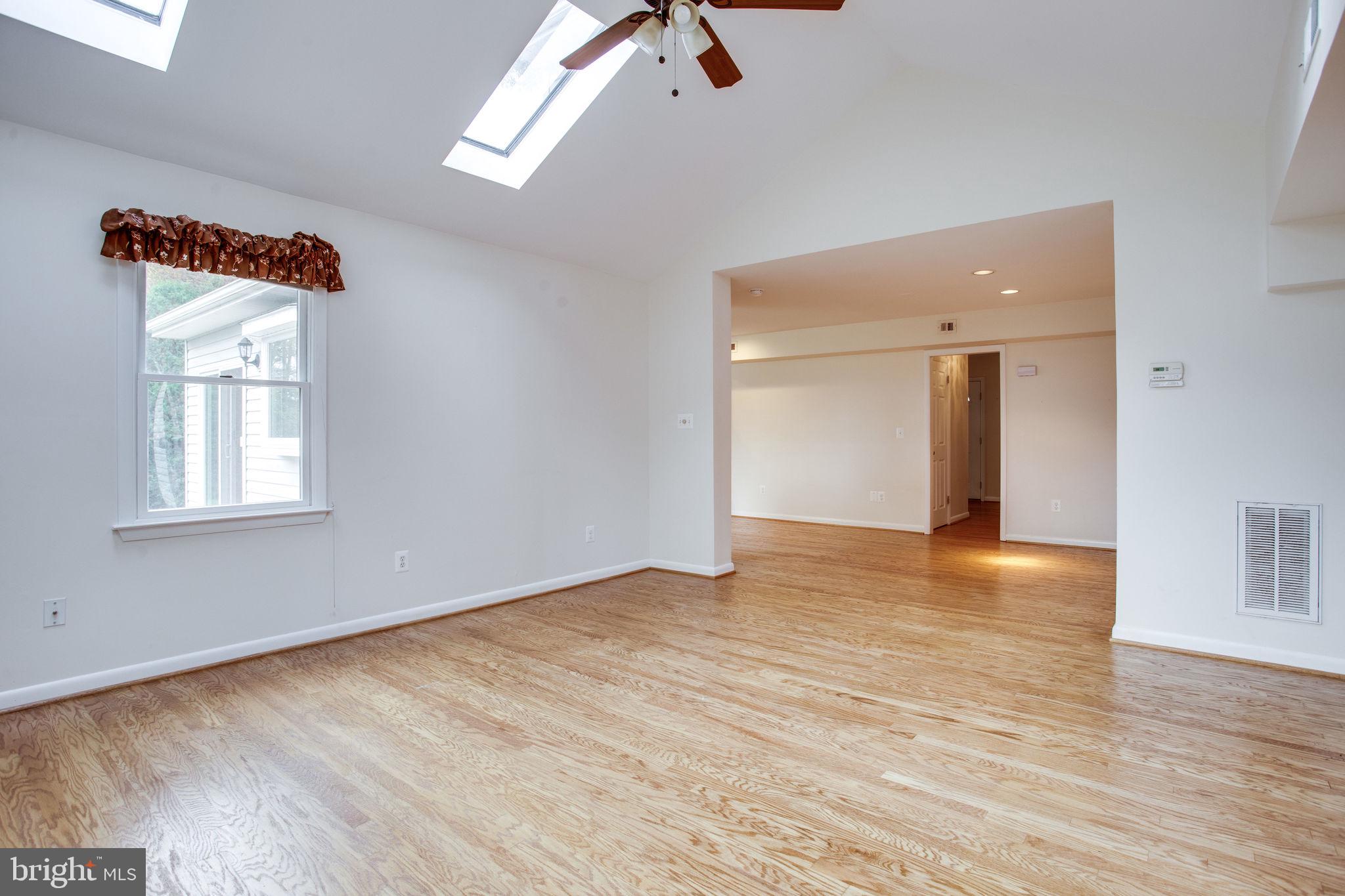 9713 Clarks Crossing Road Vienna, VA 22182 - Photo 14 of 36 Bright Family Room w/ Vaulted Ceiling & Skylights