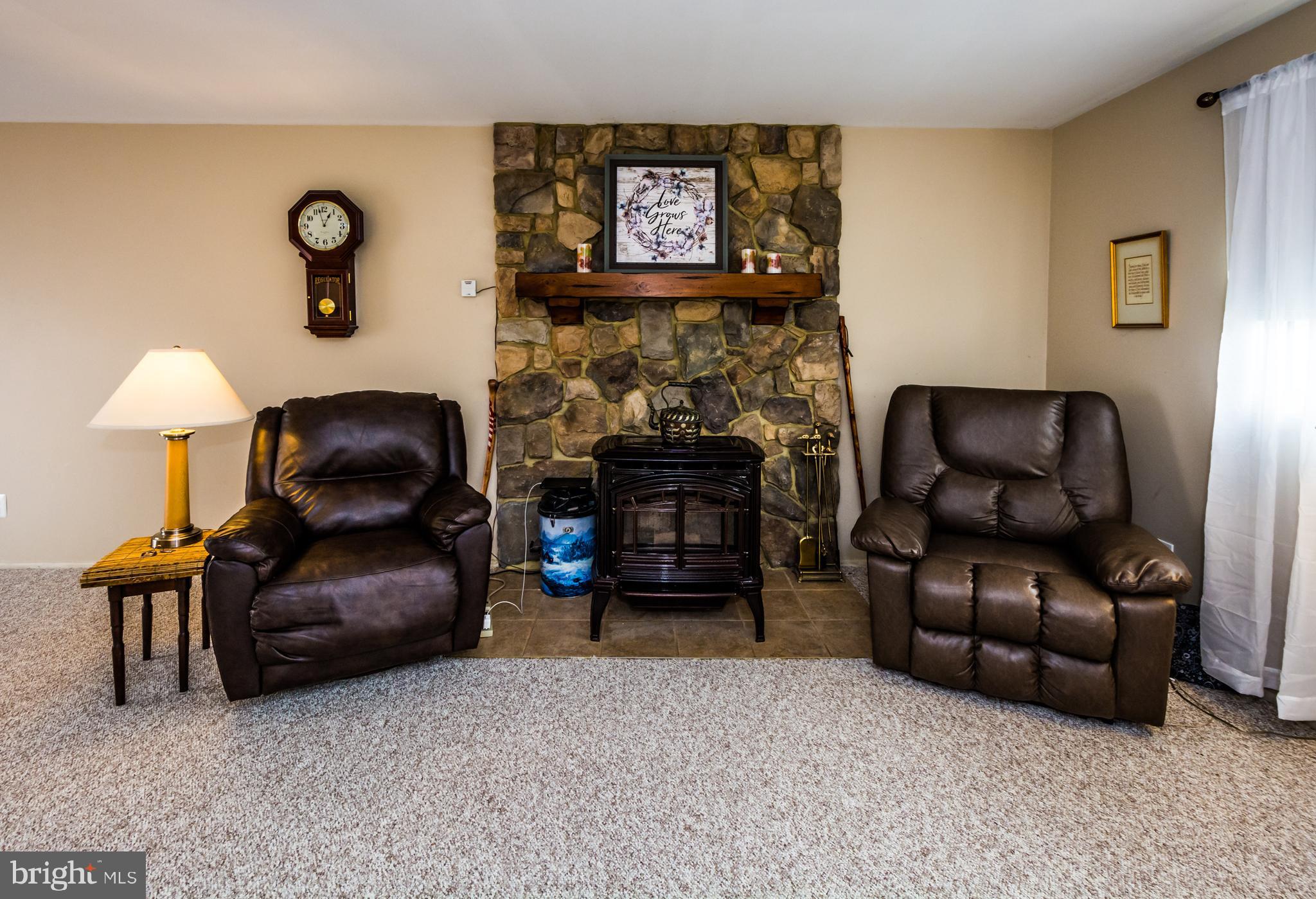 123 Chell Road Joppa, MD 21085 - Photo 18 of 66 Living Room with Stone wall & Pellet Stove