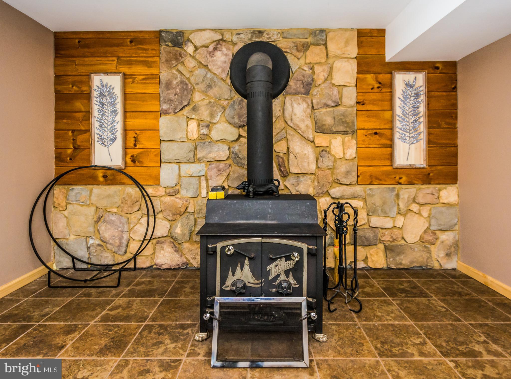 123 Chell Road Joppa, MD 21085 - Photo 40 of 66 Warm Wood Stove in Basement Family Room