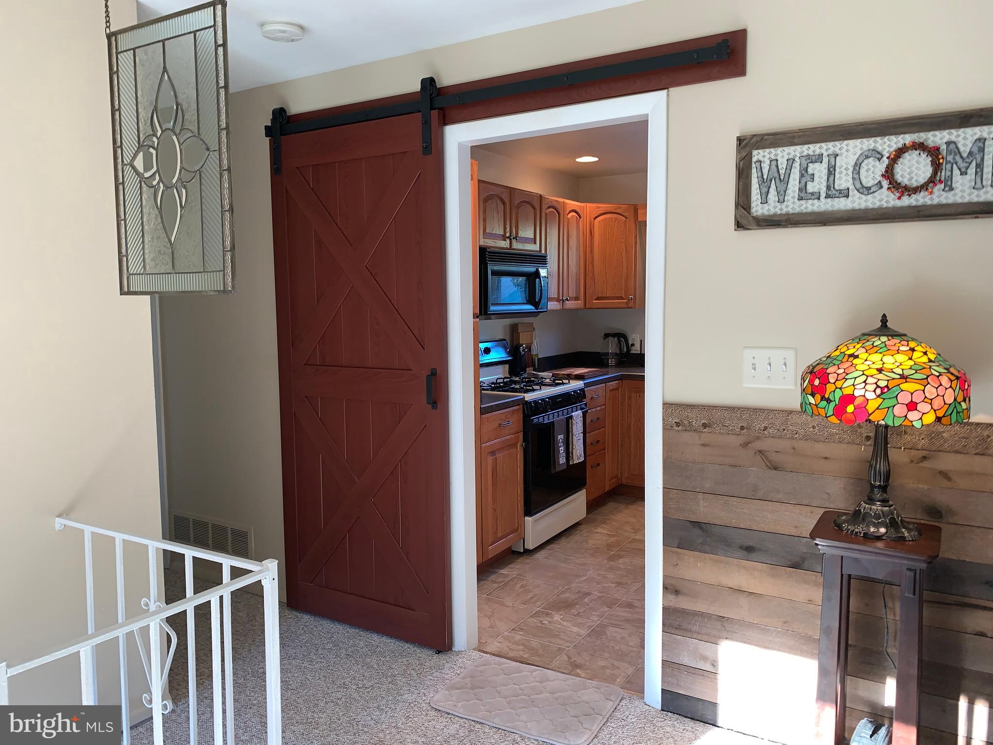 123 Chell Road Joppa, MD 21085 - Photo 7 of 66 Stylish Barn Door entrance to Kitchen
