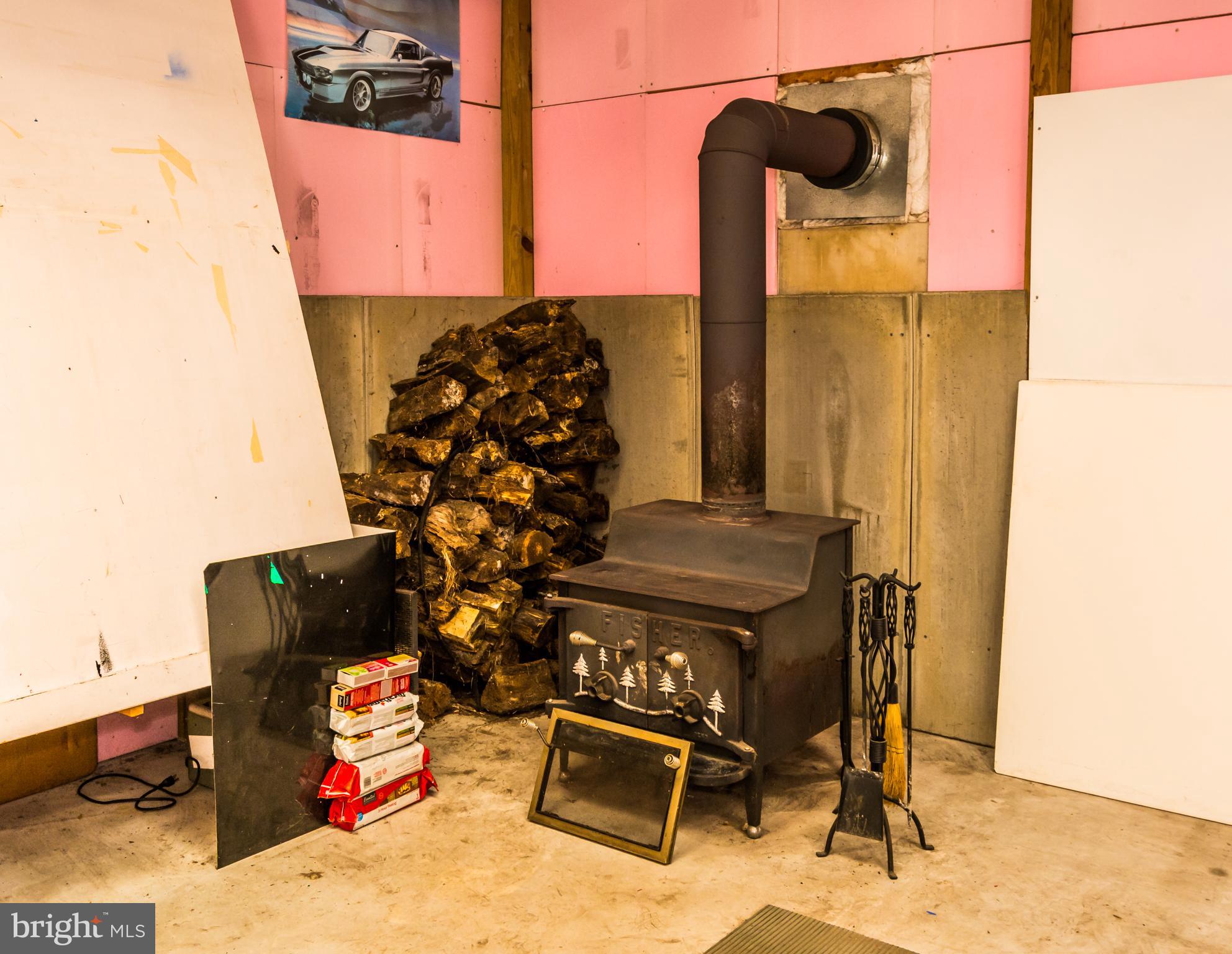 123 Chell Road Joppa, MD 21085 - Photo 64 of 66 Wood burning stove in Garage/pole barn