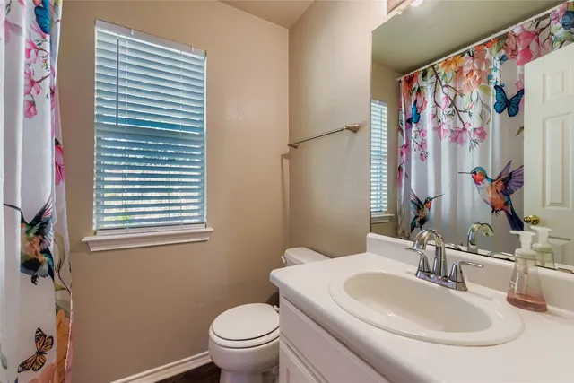 a front view of a house with a large window