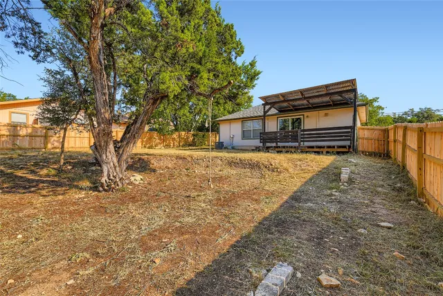 a view of outdoor space with wooden floor