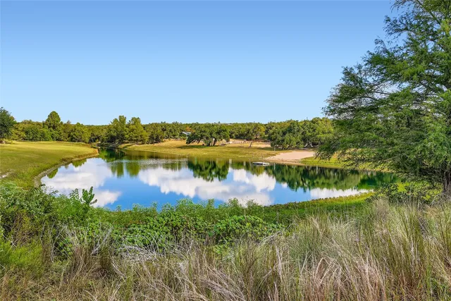 a bedroom with furniture and a wooden floor
