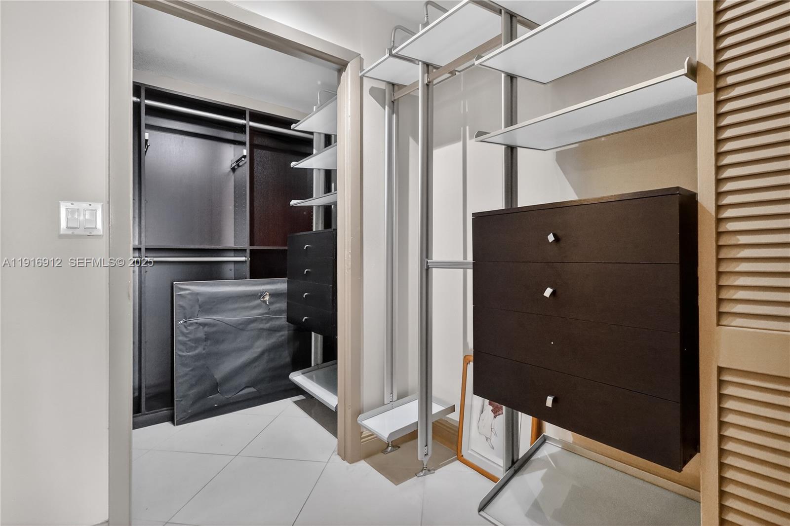 4000 Towerside Terrace, Unit 1612 Miami, FL 33138 - Photo 15 of 49 a view of closet area