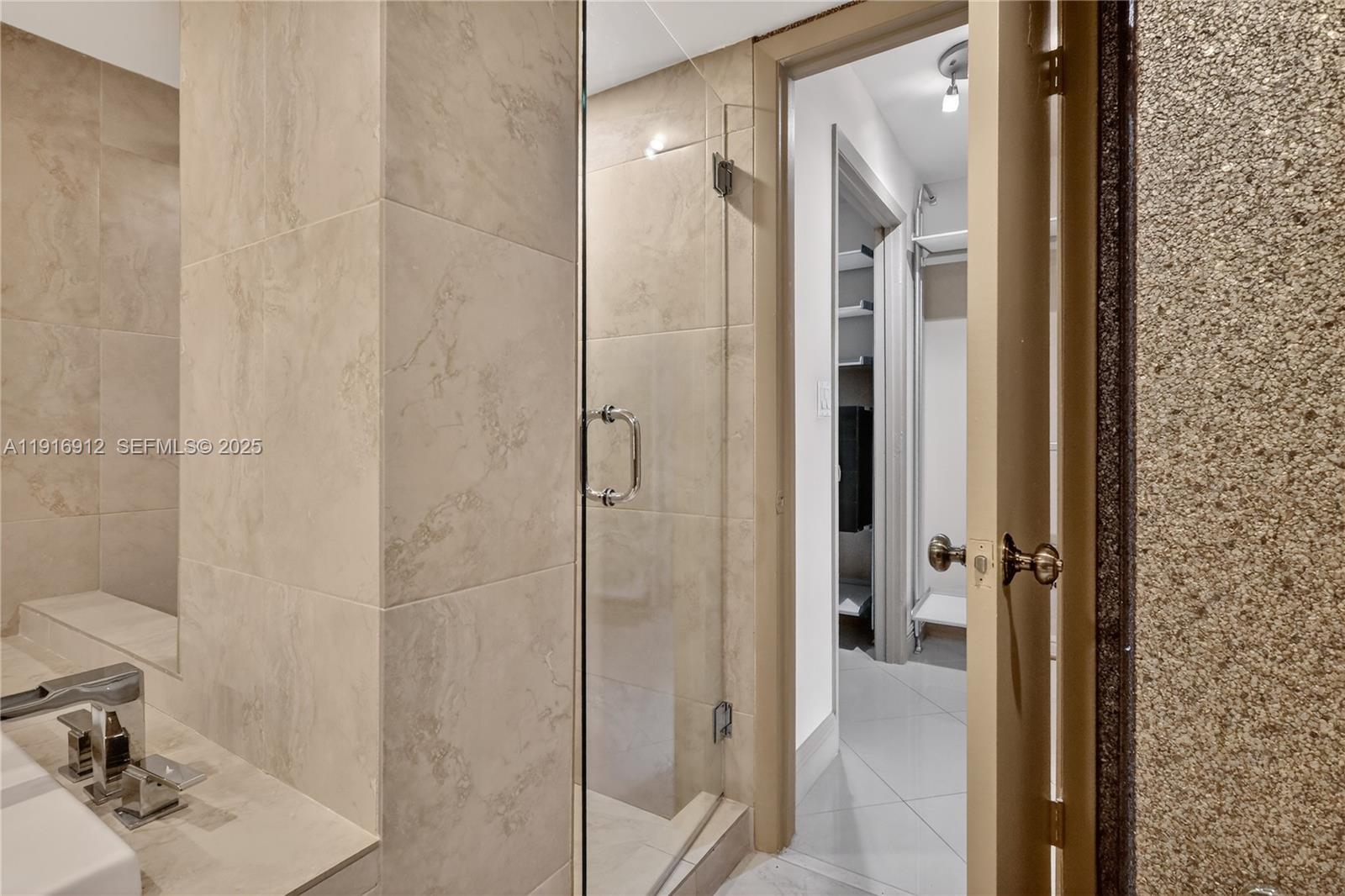 4000 Towerside Terrace, Unit 1612 Miami, FL 33138 - Photo 24 of 49 a bathroom with a shower and a sink