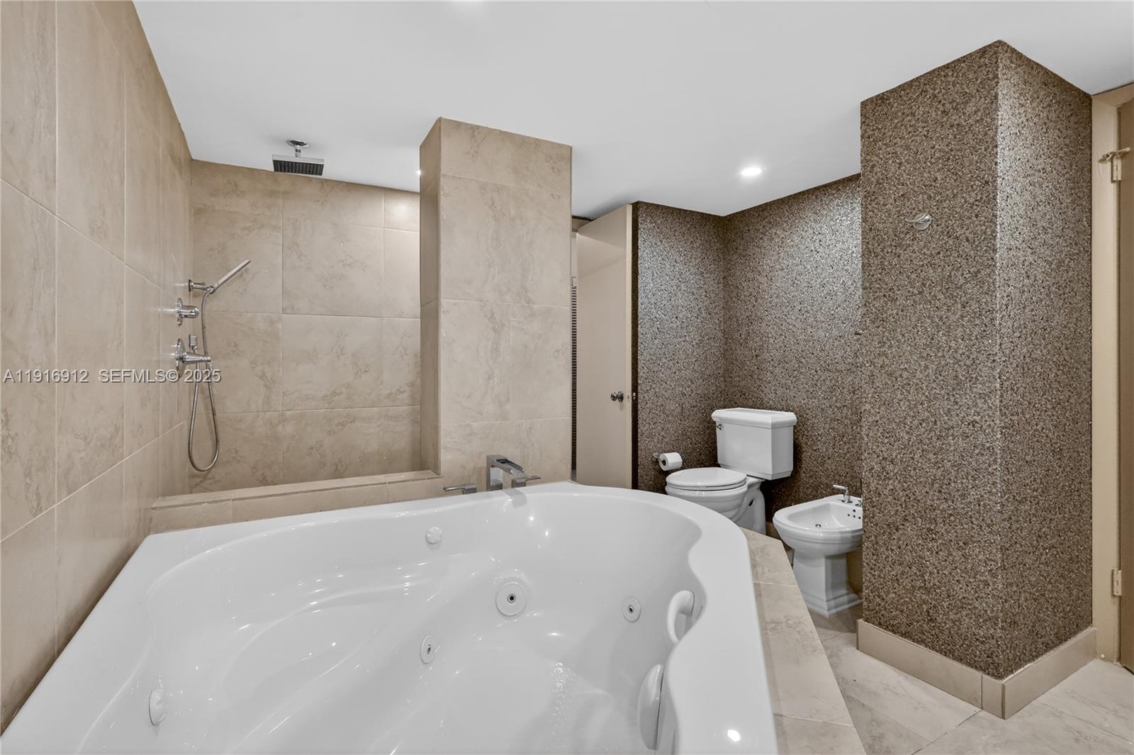 4000 Towerside Terrace, Unit 1612 Miami, FL 33138 - Photo 25 of 49 a bathroom with a toilet and shower