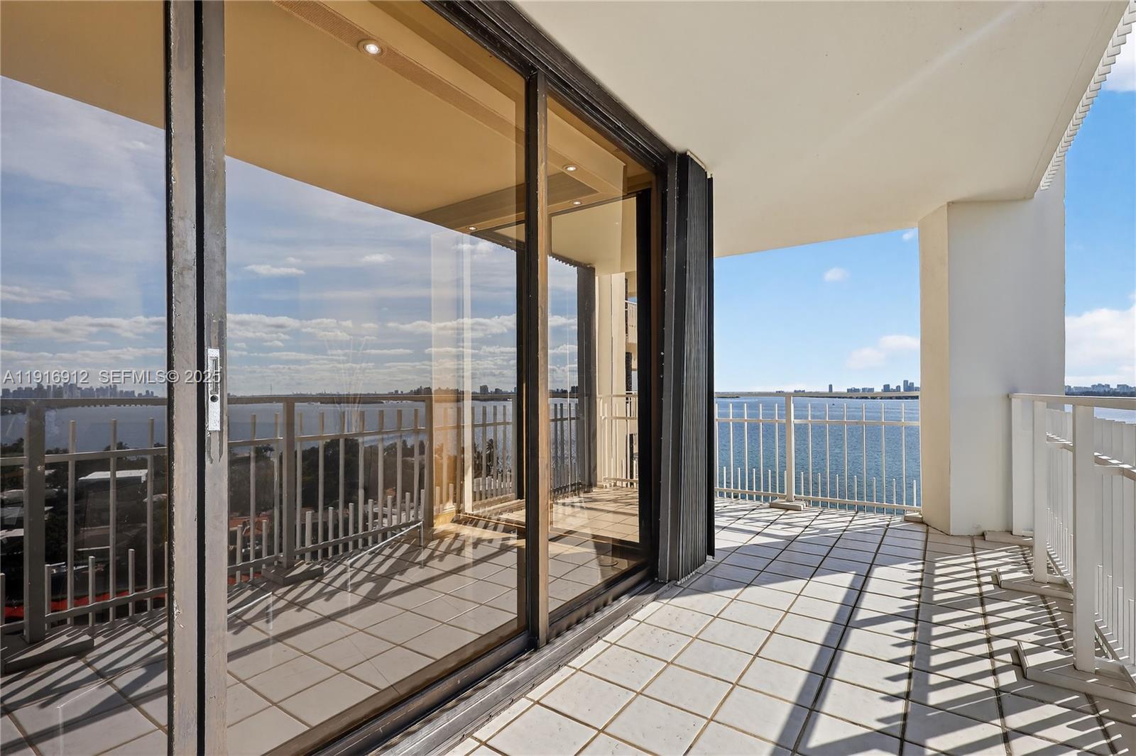 4000 Towerside Terrace, Unit 1612 Miami, FL 33138 - Photo 47 of 49 a view of a balcony with wooden floor