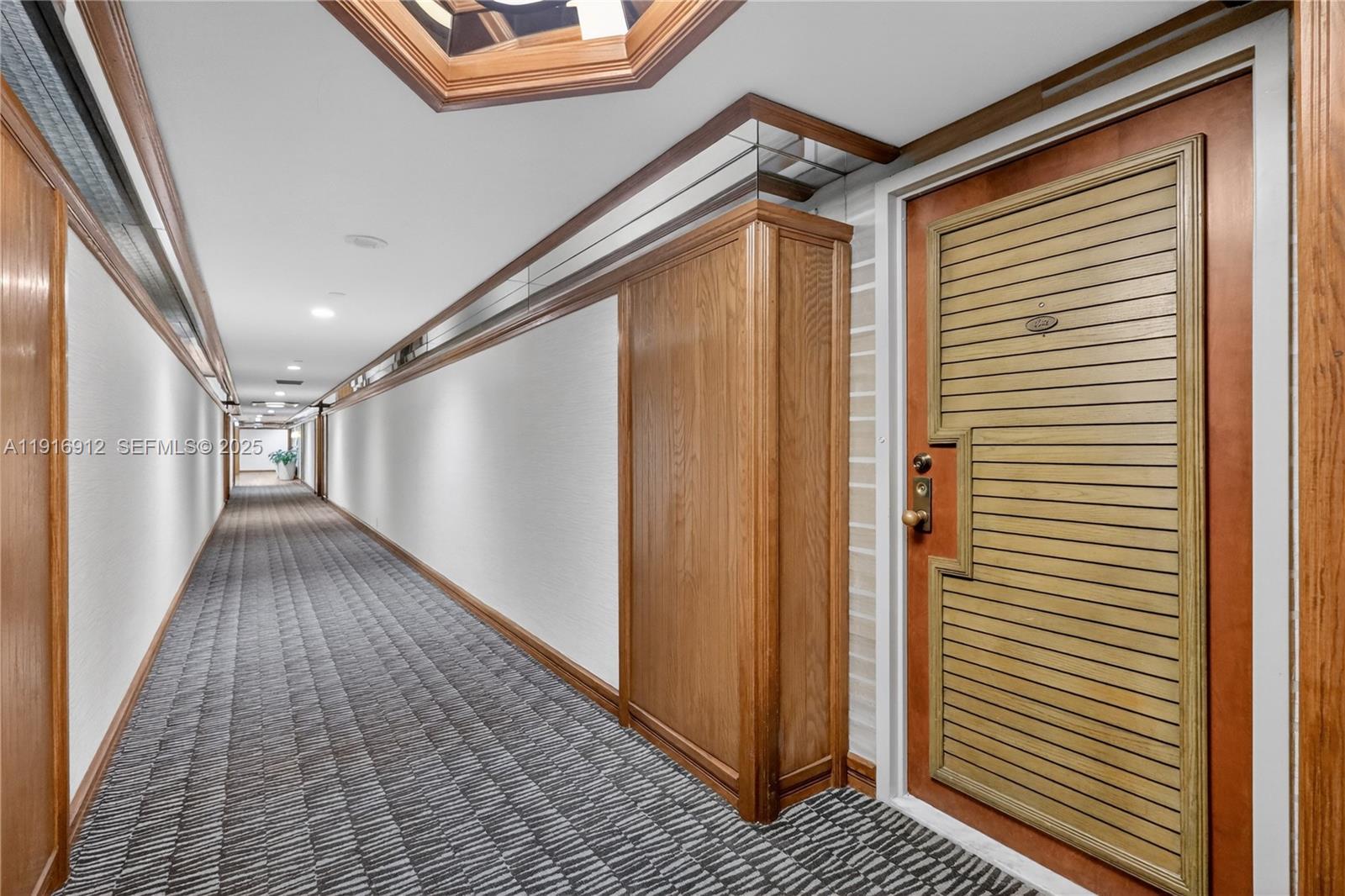 4000 Towerside Terrace, Unit 1612 Miami, FL 33138 - Photo 48 of 49 a view of hallway with stairs