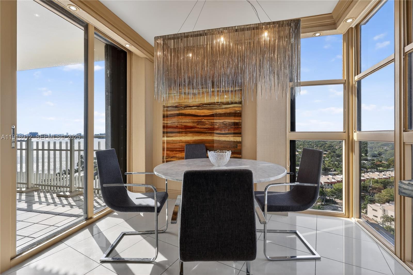 4000 Towerside Terrace, Unit 1612 Miami, FL 33138 - Photo 5 of 49 a view of a dining room with furniture window and wooden floor