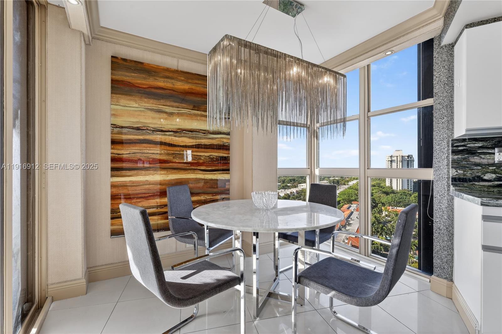 4000 Towerside Terrace, Unit 1612 Miami, FL 33138 - Photo 6 of 49 a view of a dining room with furniture window and outside view