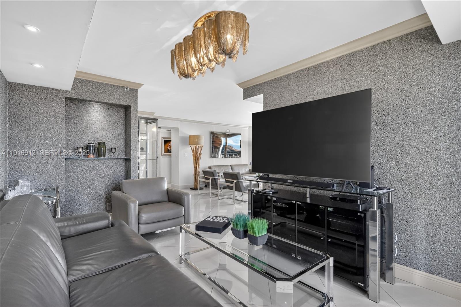 4000 Towerside Terrace, Unit 1612 Miami, FL 33138 - Photo 8 of 49 a living room with furniture and a flat screen tv