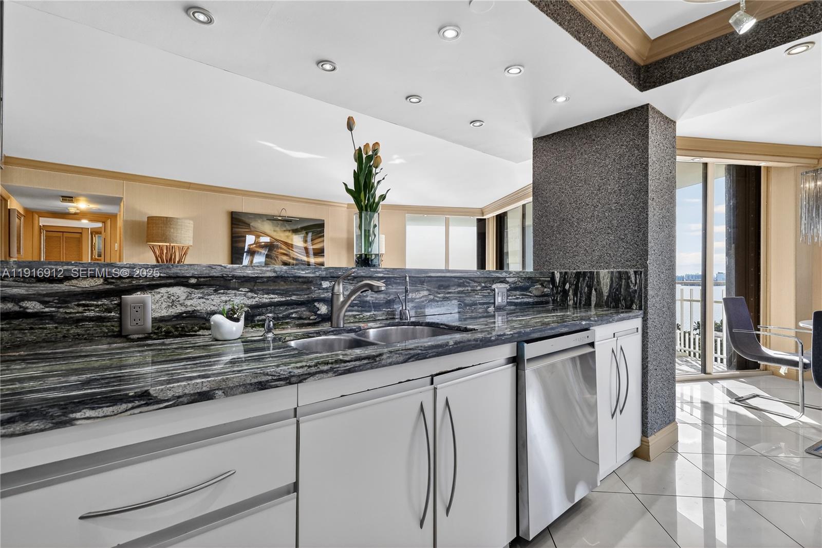 4000 Towerside Terrace, Unit 1612 Miami, FL 33138 - Photo 10 of 49 a large bathroom with a double vanity sink and a mirror