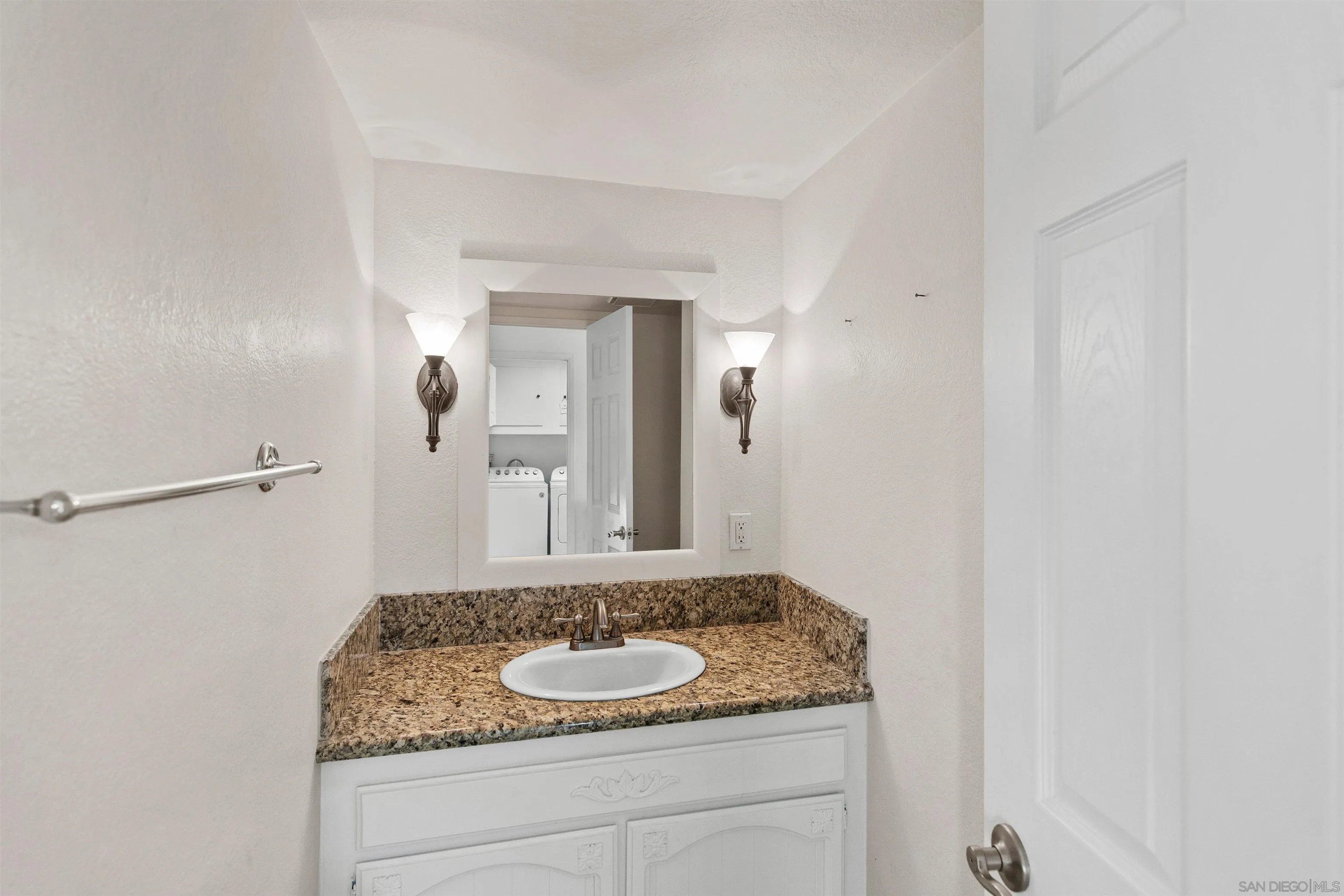 580-582 South Grade Road Alpine, CA 91901 - Photo 25 of 40 a bathroom with a granite countertop sink and a mirror