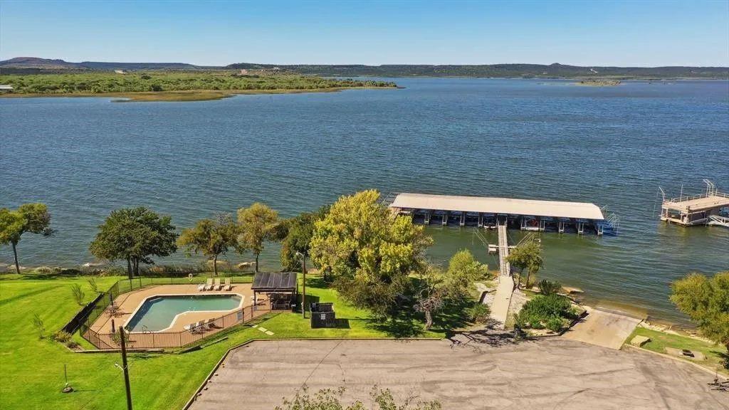 1655 Cedar Crest Loop, Unit A1 Graford, TX 76449 - Photo 2 of 15 a view of a lake with a mountain
