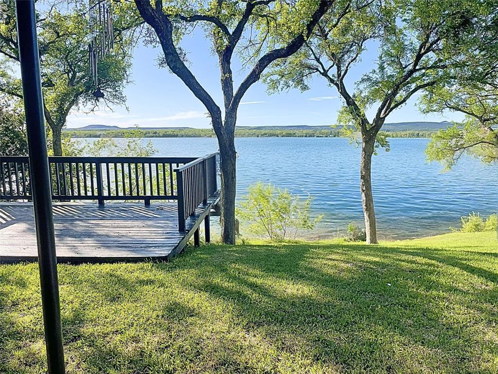 1655 Cedar Crest Loop, Unit A1 Graford, TX 76449 - Photo 4 of 15 a view of swimming pool from a garden