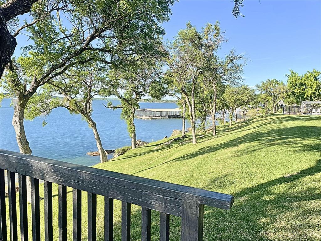 1655 Cedar Crest Loop, Unit A1 Graford, TX 76449 - Photo 5 of 15 a view of a backyard with a small yard