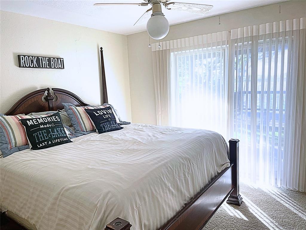 1655 Cedar Crest Loop, Unit A1 Graford, TX 76449 - Photo 9 of 15 a bedroom with a bed and window