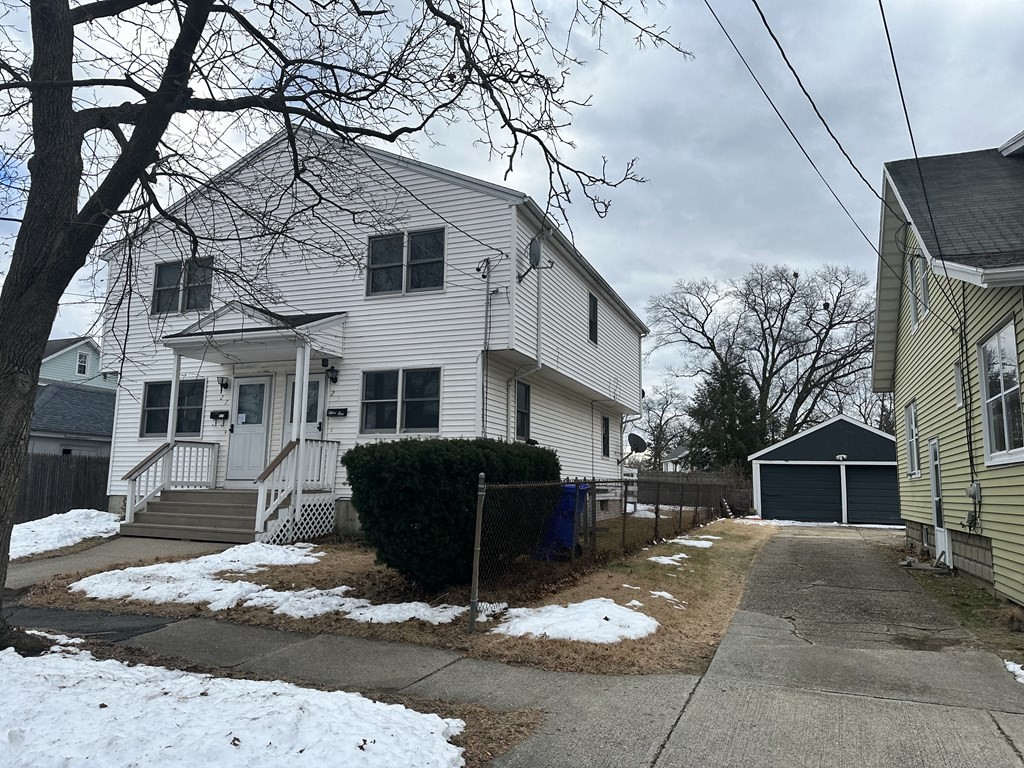 25-27 Merida Street Springfield, MA 01104 - Photo 3 of 20 a front view of a house with a yard