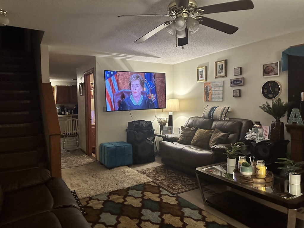 25-27 Merida Street Springfield, MA 01104 - Photo 10 of 20 a living room with furniture and a rug