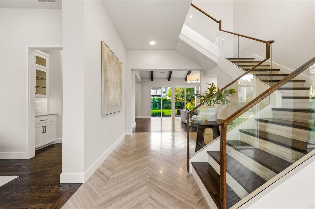 6523 Northwood Road Dallas, TX 75225 - Photo 3 of 36 a view of entryway and hall with wooden floor