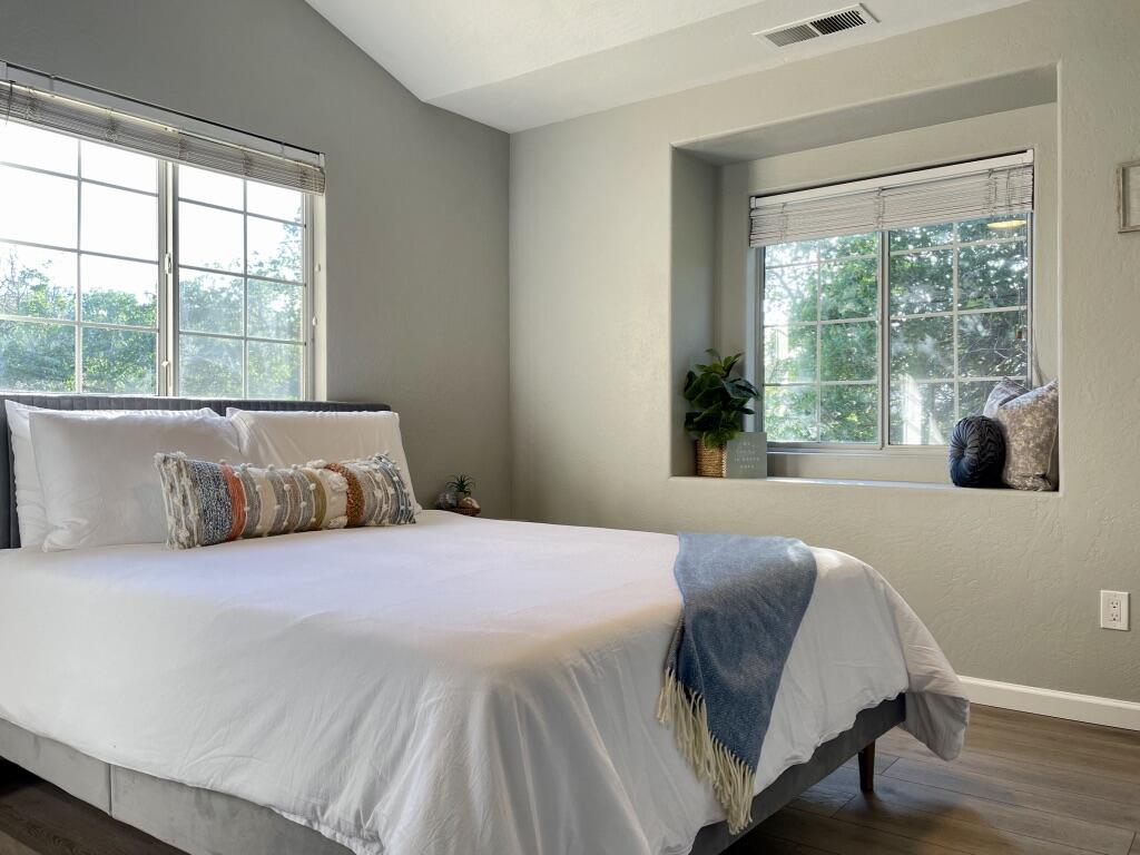 45233 Mineral King Road Three Rivers, CA 93271 - Photo 16 of 39 a bedroom with a bed and wooden floor