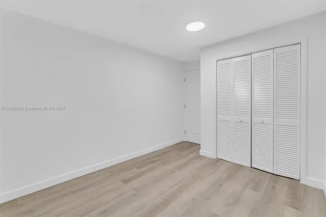 a bathroom with a toilet sink and shower