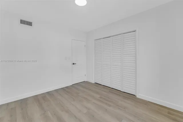 a view of empty room with windows