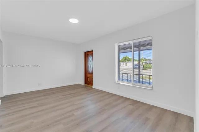 a view of cabinets a sink and wooden floor