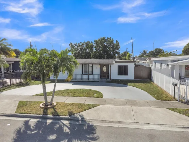 a view of backyard with large windows