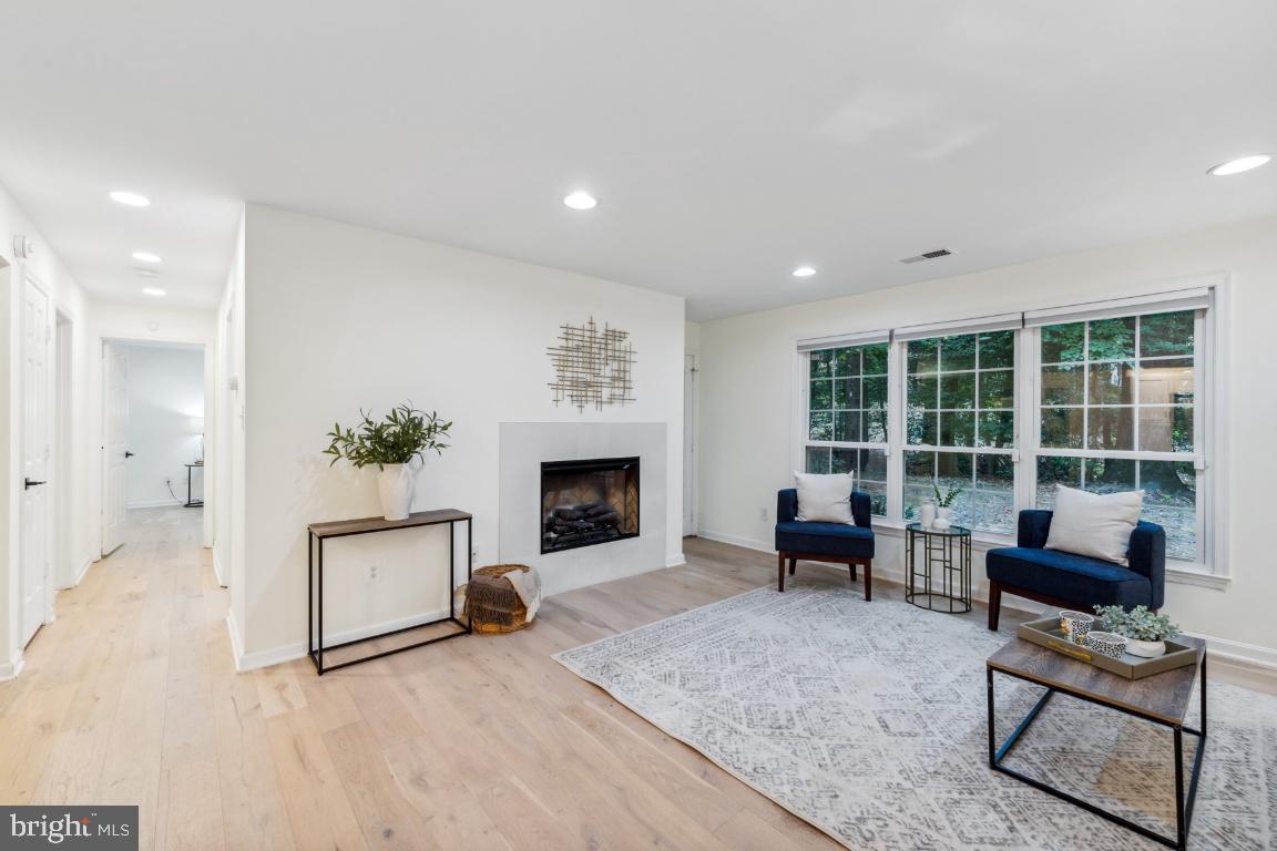 2229 Lovedale Lane, Unit 302B Reston, VA 20191 - Photo 5 of 25 Electric fireplace and door to patio