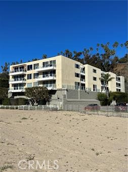 723 Palisades Beach Road, Unit 101 Santa Monica, CA 90402 - Photo 23 of 28 a view of a building with two chairs