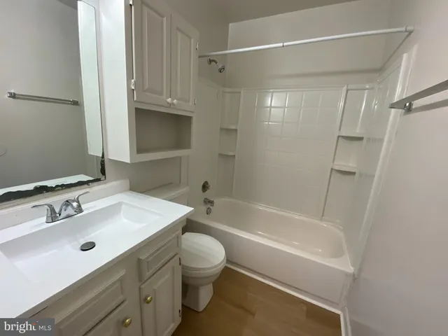 a bathroom with a sink a toilet and a bathtub