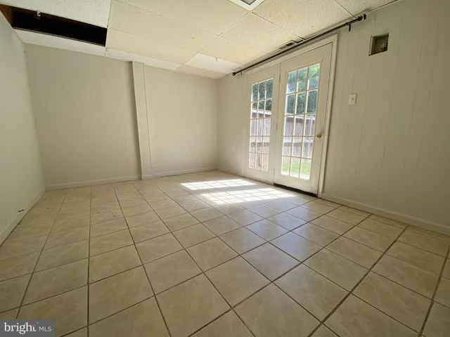 a view of an empty room and window