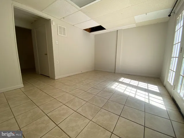 a view of an empty room and window