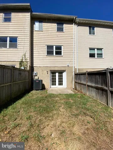 a view of a house with brick walls