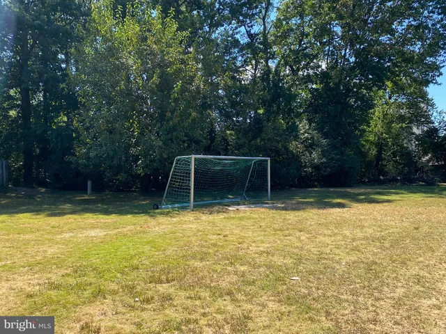 a view of a house with small yard