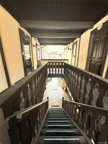 a view of wooden bench in a porch