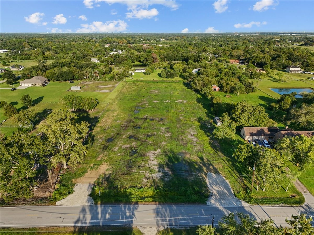 7211 FM 646 Road Santa Fe, TX 77510 - Photo 2 of 12 an aerial view of residential houses with outdoor space and trees