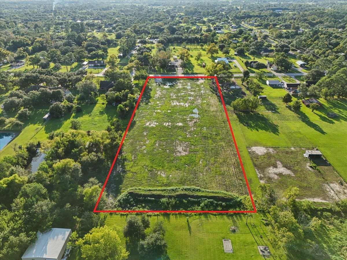 7211 FM 646 Road Santa Fe, TX 77510 - Photo 7 of 12 an aerial view of residential houses with outdoor space