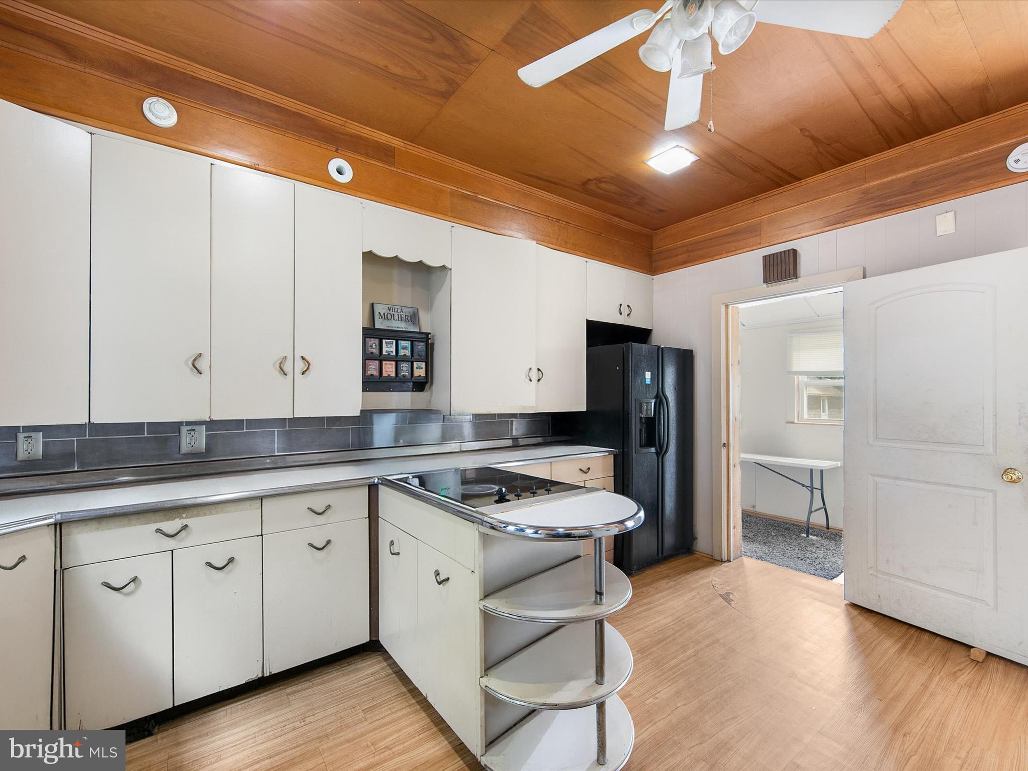 202 North Bedford Street Georgetown, DE 19947 - Photo 11 of 22 a kitchen that has a lot of cabinets in it and wooden floors