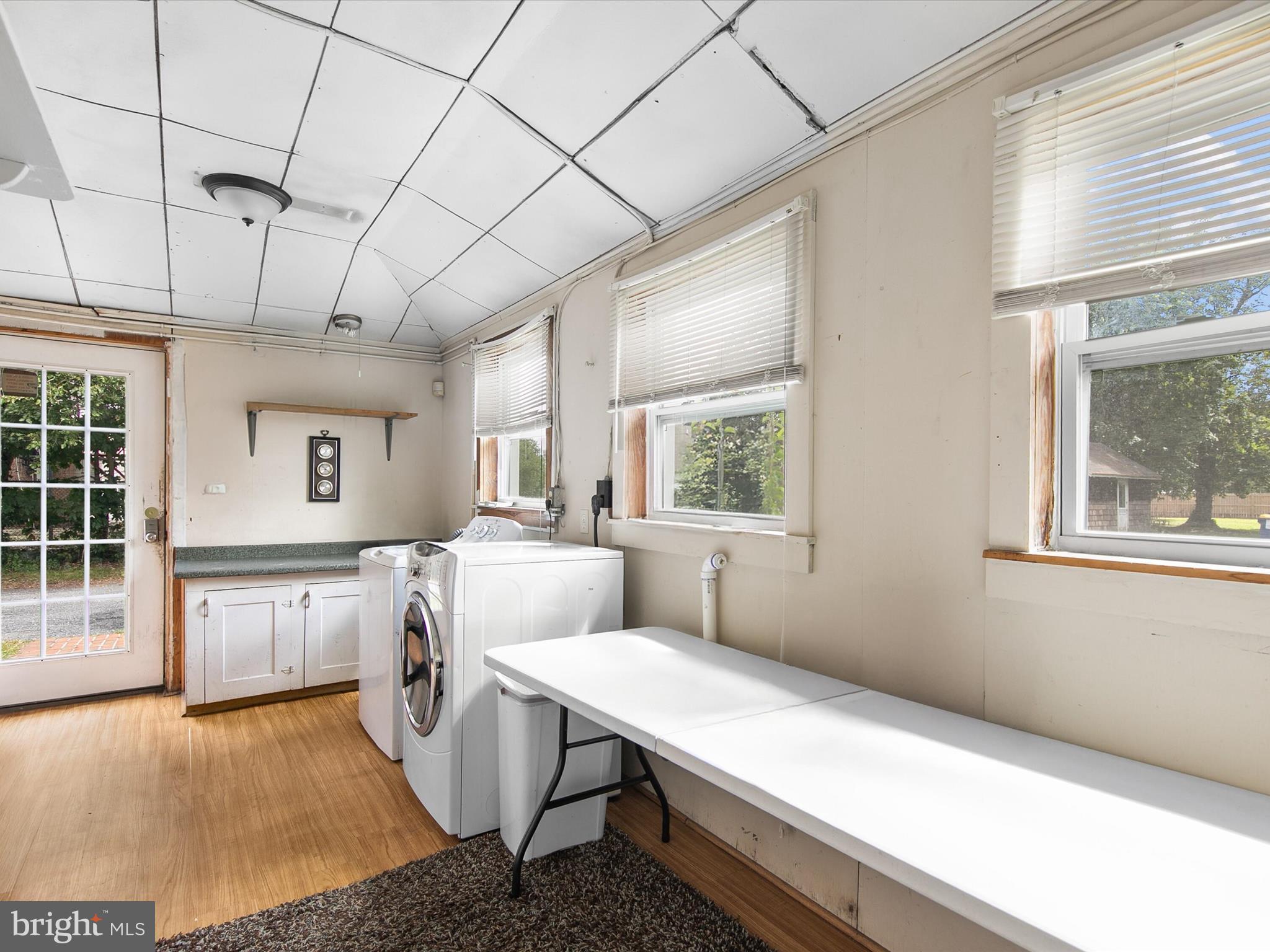 202 North Bedford Street Georgetown, DE 19947 - Photo 14 of 22 a living room with stainless steel appliances kitchen island granite countertop furniture and a window
