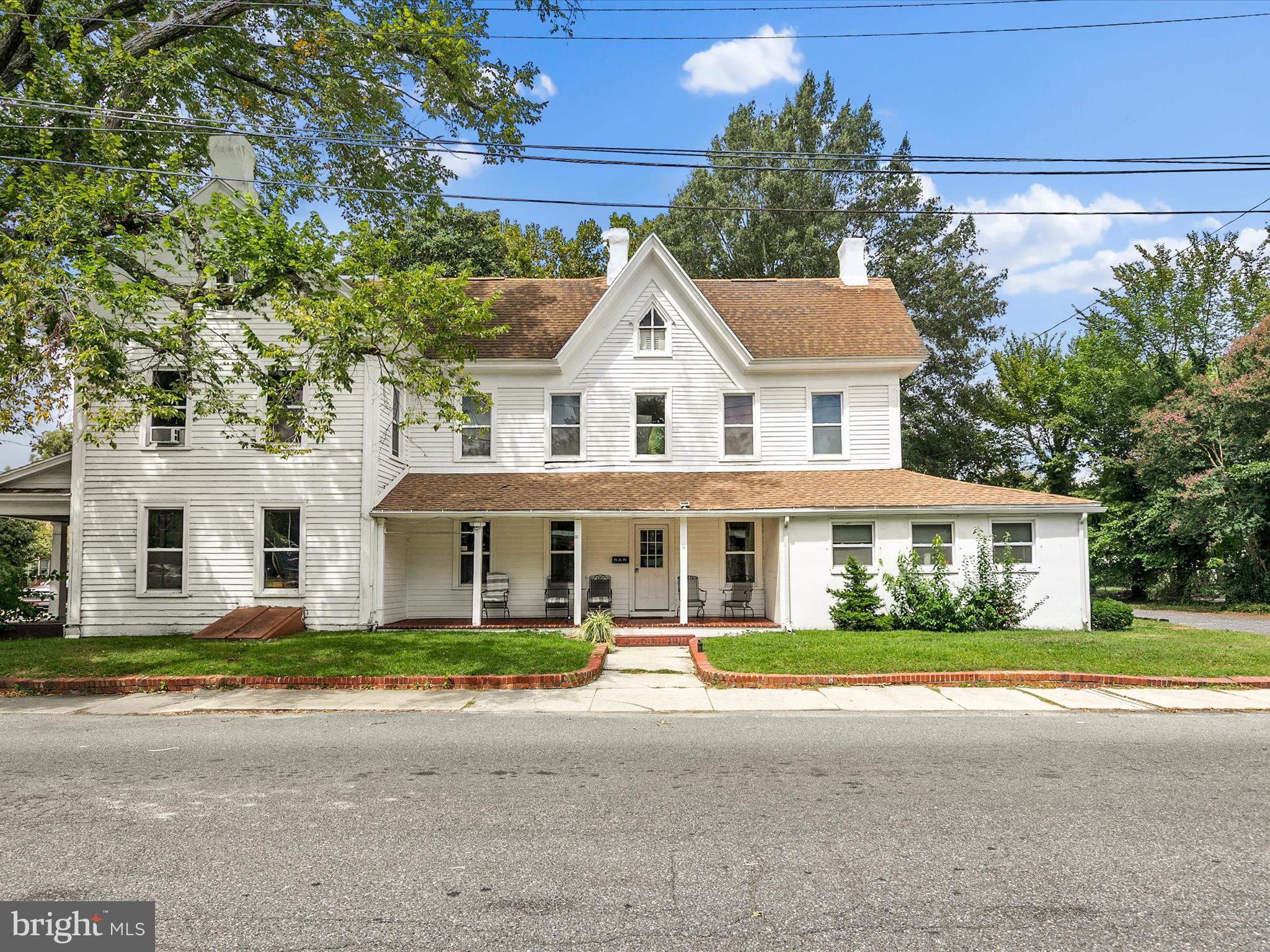 202 North Bedford Street Georgetown, DE 19947 - Photo 2 of 22 front view of a house with a street