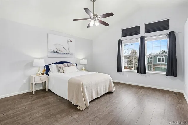 a bedroom with a large bed and a large window